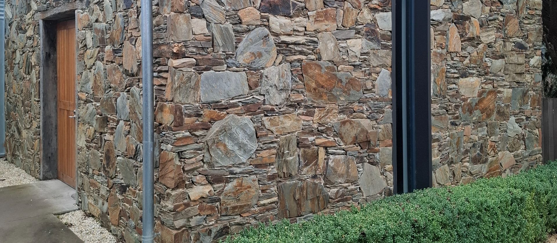 Completed field stone building hand-built by Homestead Stonework in the Canberra region
